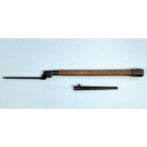 182 - An ENFIELD pattern spike bayonet with scabbard mounted on an ash handle for use as a mine probe 69cm... 