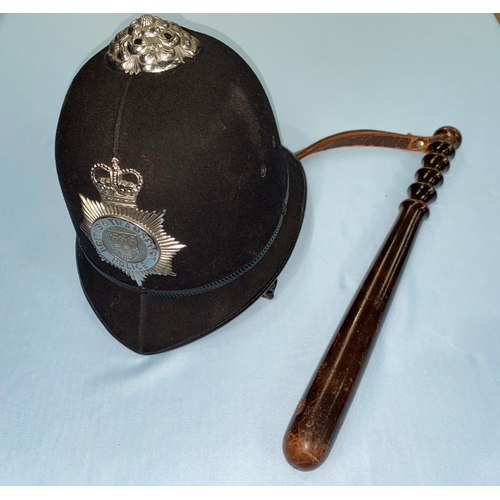 228 - A British Transport Police helmet, a hardwood truncheon