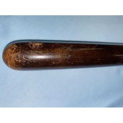 228 - A British Transport Police helmet, a hardwood truncheon