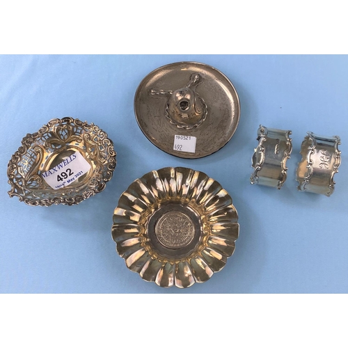 492 - A pair of hallmarked silver napkin rings, Sheffield 1914 and a hallmarked silver bon bon dish,Cheste... 