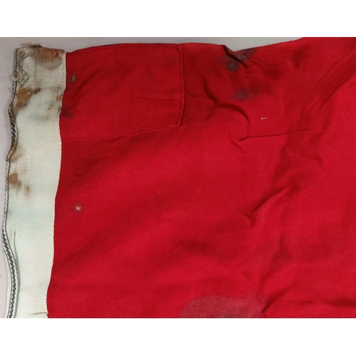 154 - A German WWII era flag, with perhaps contemporary damage.  Size: 182cm x 104cm