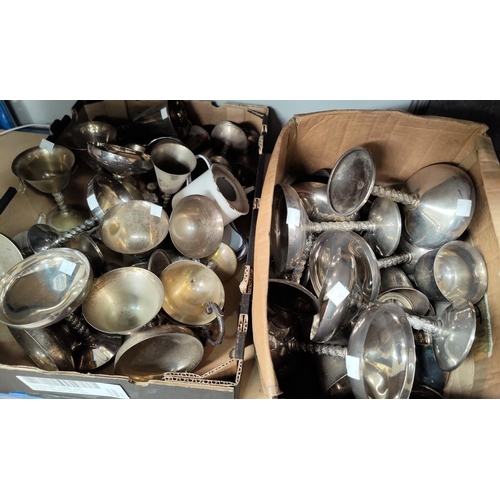 24 - A large selection of silver on brass goblets of different sizes and shapes