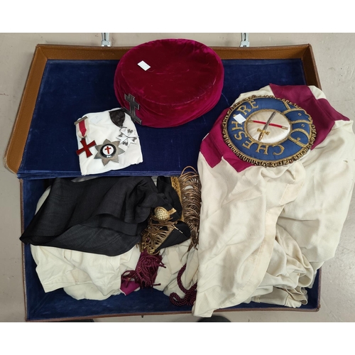 47 - A leather suitcase containing masonic robes; regalia; jewels; etc.