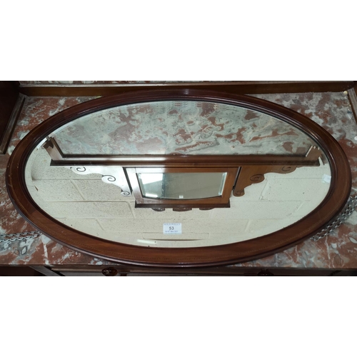 53 - Two oval wall mirrors in mahogany frames
