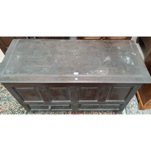 563 - An 18th century oak framed and panelled mule chest, with 4 fielded front panels over 2 drawers