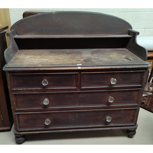 574 - A Victorian stained pine chest of 2 long and 2 short drawers with raised back and shelf