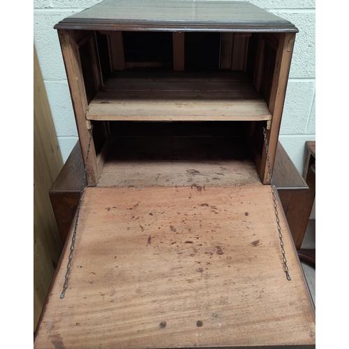 575 - A 1930's drinks cabinet with fall front upper section over double cupboard