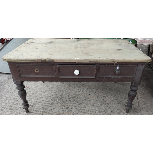 581 - A 19th century farmhouse side/kitchen table in stained pine, length 153 cm