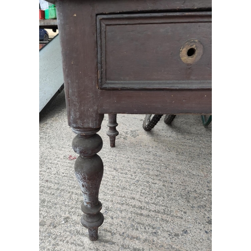 581 - A 19th century farmhouse side/kitchen table in stained pine, length 153 cm