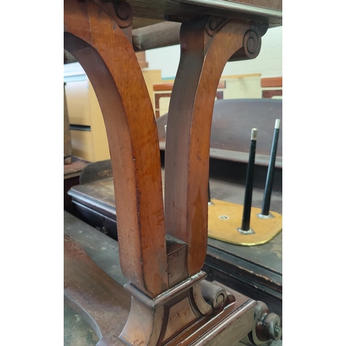 591 - A Victorian mahogany side table/washstand with 3 frieze drawers, pierced end supports, on scroll fee... 