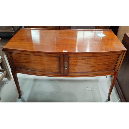 595 - An early 20th century mahogany side cabinet with bow front, enclosed by 2 doors, width 117 cm