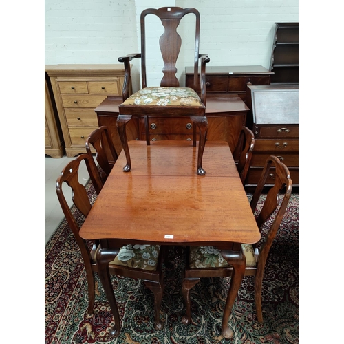 597 - A 1930's mahogany dining suite in the Queen Anne style comprising extending table with rectangular t... 