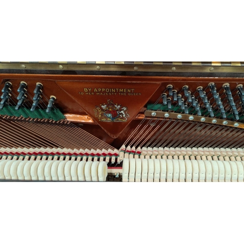 600 - A modern small piano in mahogany case, iron framed and overstrung, by John Broadwood & Sons, with bo... 