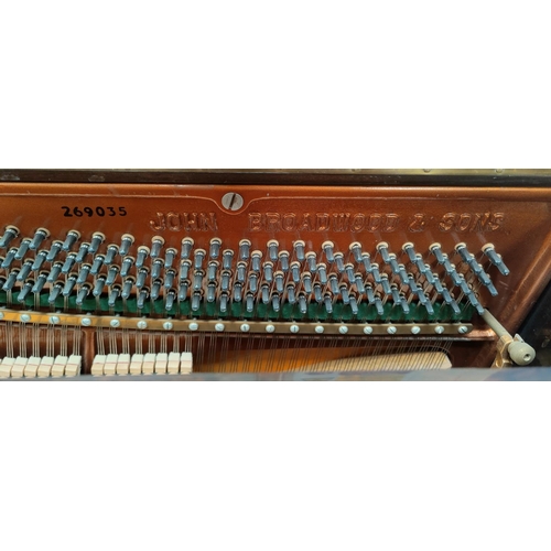 600 - A modern small piano in mahogany case, iron framed and overstrung, by John Broadwood & Sons, with bo... 