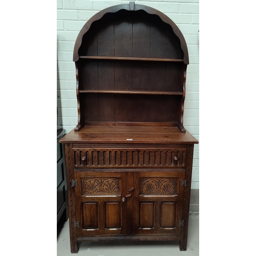 609 - A reproduction oak Dutch dresser with 2 height delft rack over drawer and double cupboard