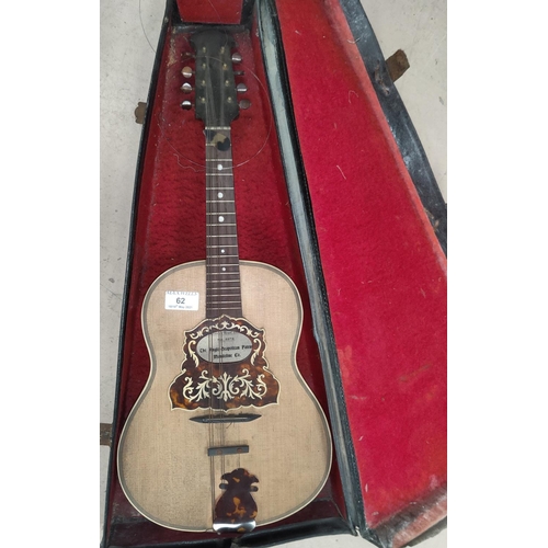 62 - An Anglo-Neapolitan guitar shaped mandolin with portrait to the reverse, cased