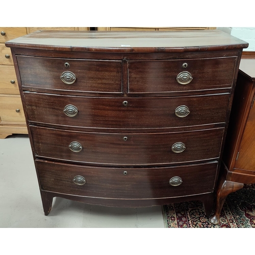 620 - An early 19th century mahogany bow front chest of 3 long and 2 short drawers with brass drop handles... 