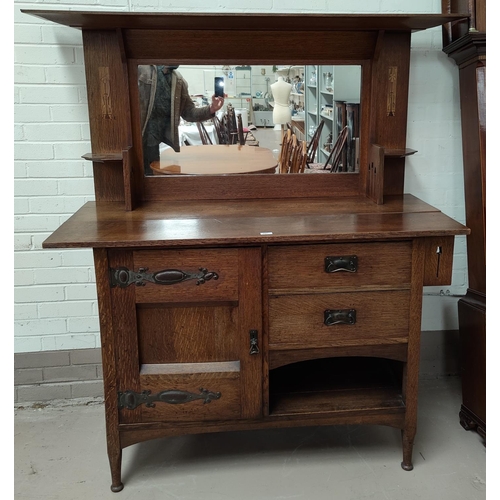 627 - An Edwardian inlaid oak sideboard in the Arts & Crafts style with mirror back, side cupboard  on str... 