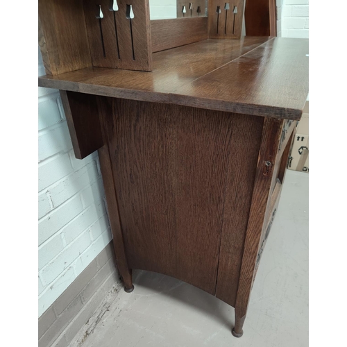 627 - An Edwardian inlaid oak sideboard in the Arts & Crafts style with mirror back, side cupboard  on str... 