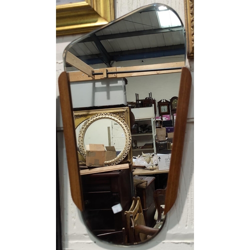 63A - A mid 20th century wall mirror with teak strips to the side and an asymmetric shape ht 57cm