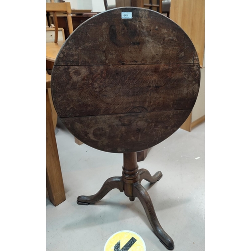 645 - An 18th century country oak tripod table, diameter 62 cm