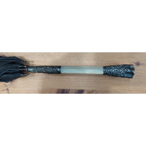 65 - An Edwardian umbrella with mother-of-pearl handle and embossed silver mounts (unmarked)