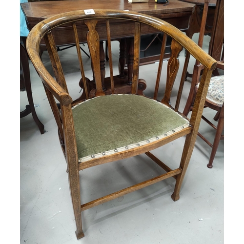 654 - An Edwardian inlaid and stained wood tub shaped armchair on square tapering legs