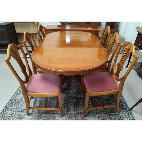 658 - A Regency style dining suite comprising extending table on single pedestals, 6 shield back chairs, a... 