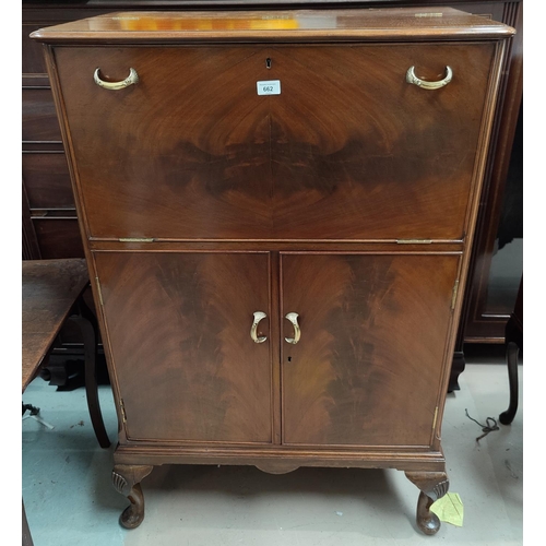 662 - A figured mahogany drinks/ cocktail cabinet with part suite of cut drinking glasses