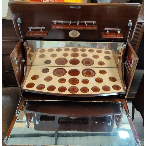 662 - A figured mahogany drinks/ cocktail cabinet with part suite of cut drinking glasses