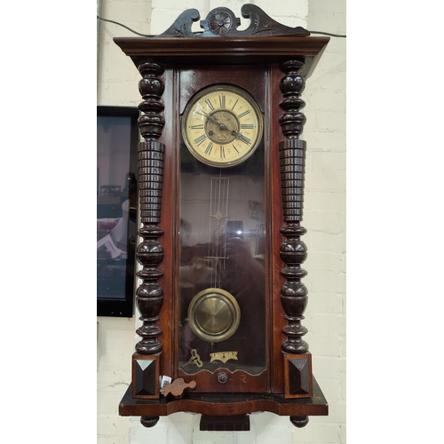 668 - A Vienna wall clock in walnut case with striking spring driven movement