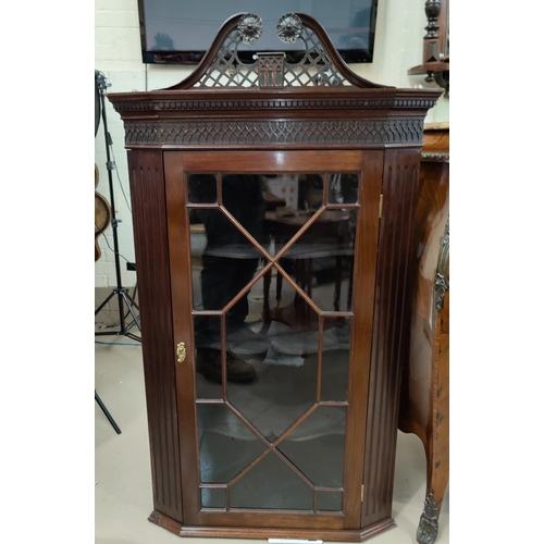 670a - A 19th century Georgian style mahogany straight front corner cabinet with pierced swan neck pediment... 