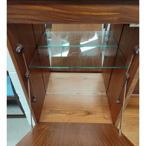 680 - A mid 20th century teak G-Plan side unit having 3 cupboards, 3 drawers, pull down cupboard above wit... 