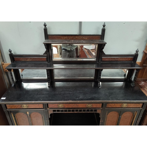 681 - An ebonised and walnut mirror back side unit with 2 cupboards, 3 drawers, central shelf space with 4... 