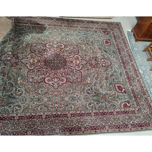 713 - An impressive large Middle Eastern style carpet, fawn ground with geometric decoration and animals e... 