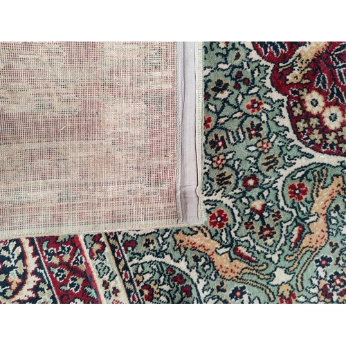 713 - An impressive large Middle Eastern style carpet, fawn ground with geometric decoration and animals e... 