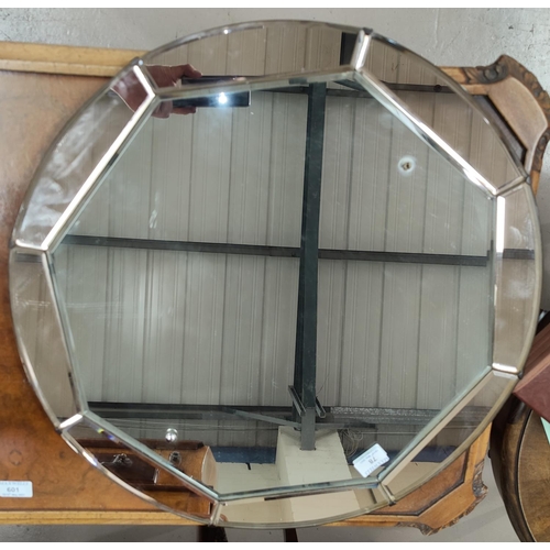 78 - An Art Deco wall mirror in circular peach frame