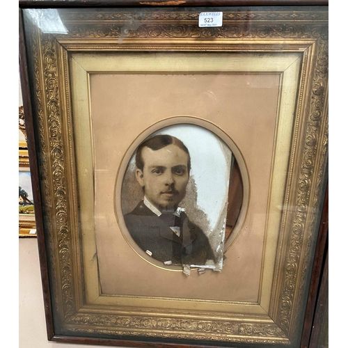 523 - A Victorian pair of cabinet frames containing photo portraits of a man and woman, 70 x 59 cm overall