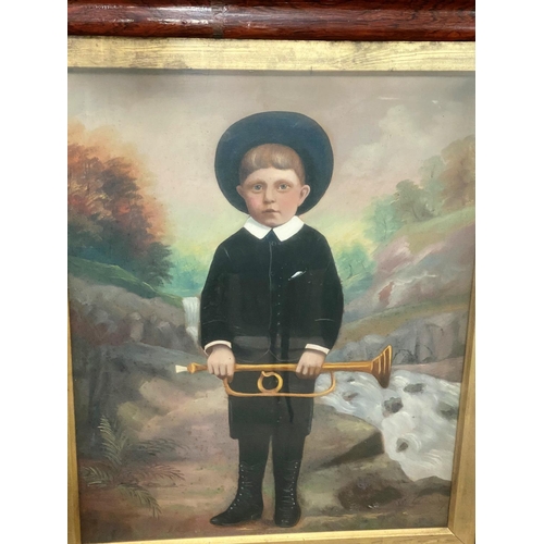 526 - A Victorian rosewood veneered cushion frame containing an overpainted portrait of a boy with a bugle... 