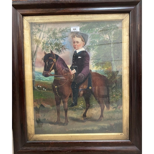 528 - A Victorian rosewood veneered cushion frame containing an overpainted portrait of a boy on a pony, 7... 