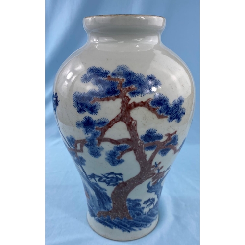 333 - A Chinese blue and white inverted baluster vase depicting trees on landscape with red highlights bea... 