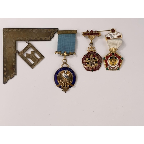 424 - A masonic pendant:  hallmarked silver set square; other enamelled medallions