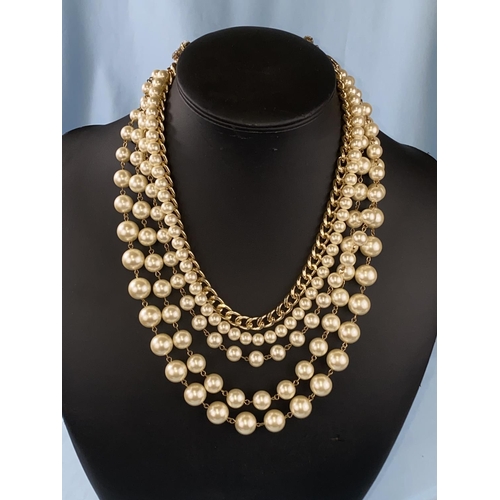 447 - An Italian Sodini simulated pearl and gilt necklace wih 4 graduating strands of pearls and a gilt ch... 