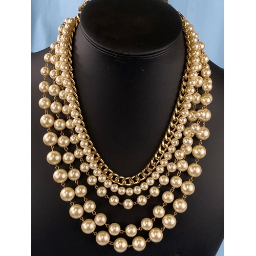 447 - An Italian Sodini simulated pearl and gilt necklace wih 4 graduating strands of pearls and a gilt ch... 