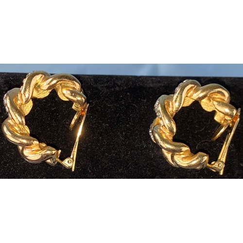 456 - A pair of large Christian Dior gilt clip-on earrings of linked hooped form