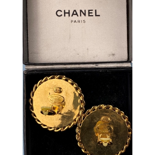 458 - A pair of Chanel earrings with central domed pearl effect with gilt surround clip-on earrings (minor... 