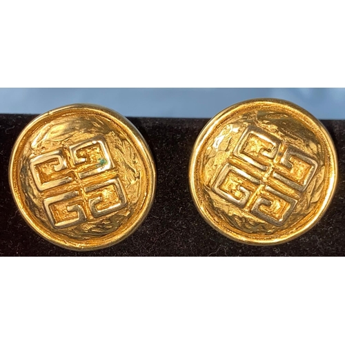 464 - A pair of Givenchy gilt circular earrings with stylized Givenchy symbol to centre