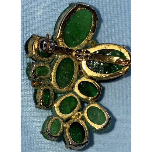 471 - A vintage Christian Dior brooch, various oval jade coloured stones in a gilt setting.