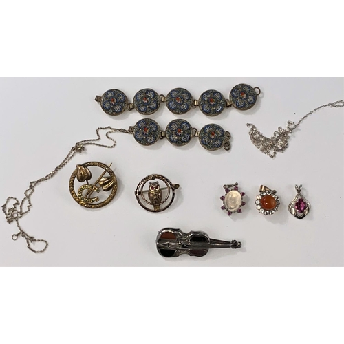 483 - A white metal violin brooch set with stone, a part mosaic bracelet, a gilt owl brooch, three pendant... 