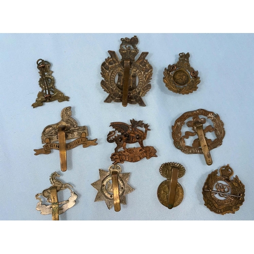 219 - 10 British army cap badges